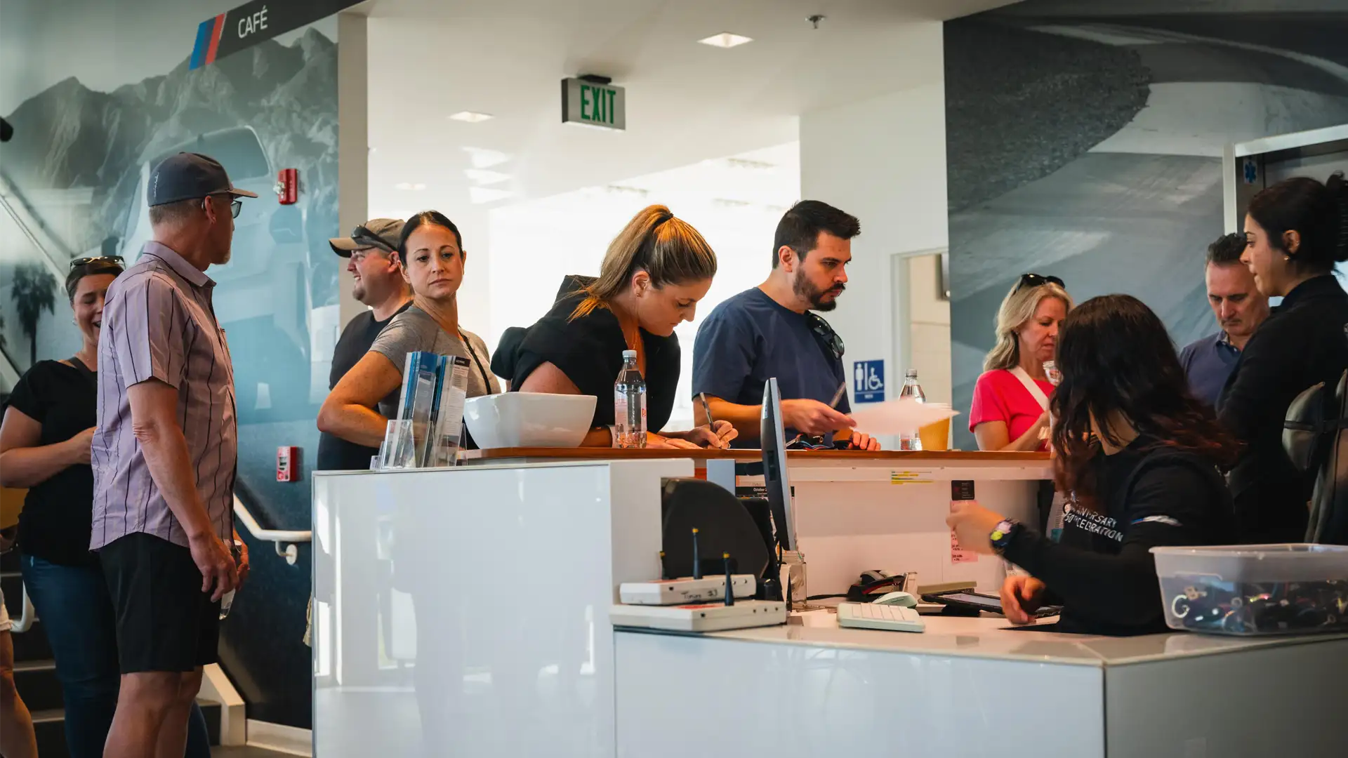 Guests queuing at the counter in the BMW M Cafe