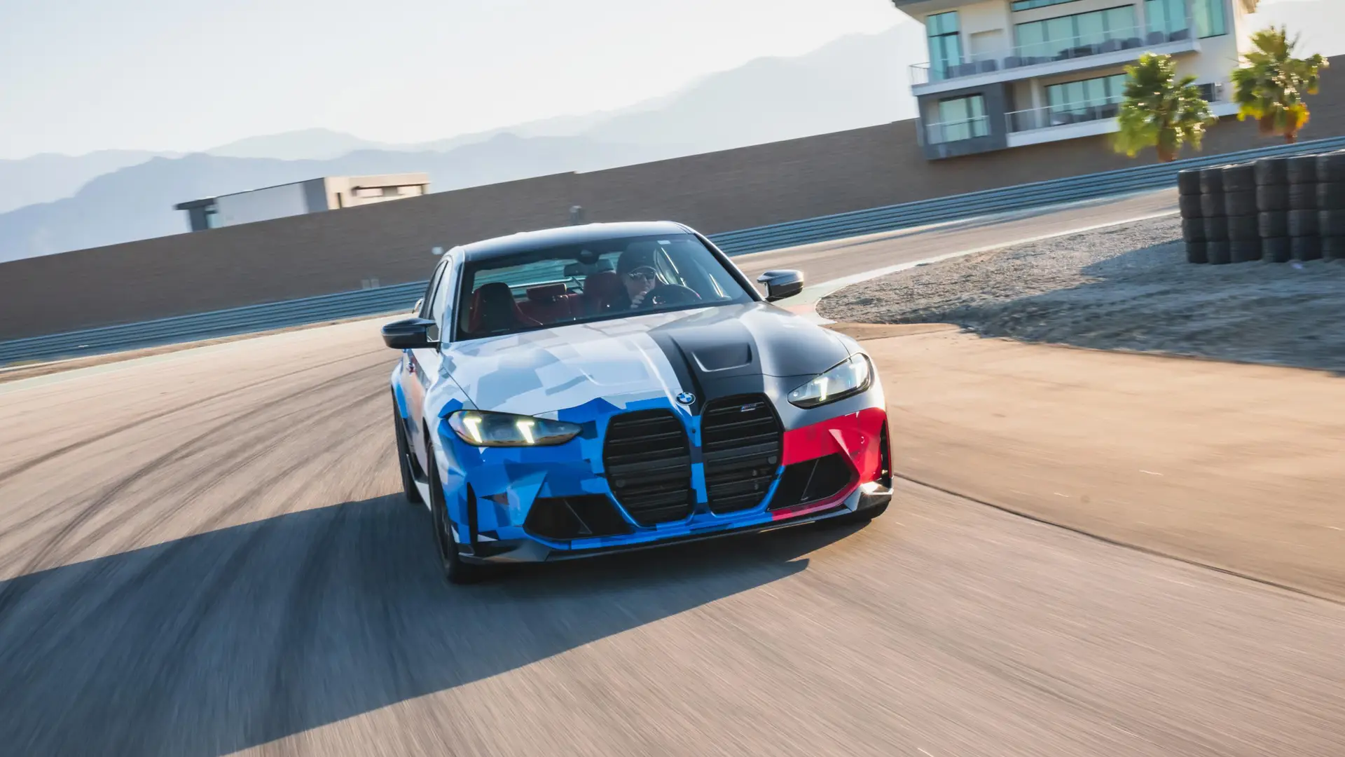 BMW M3 in Motorsport livery cornering on the desert circuit