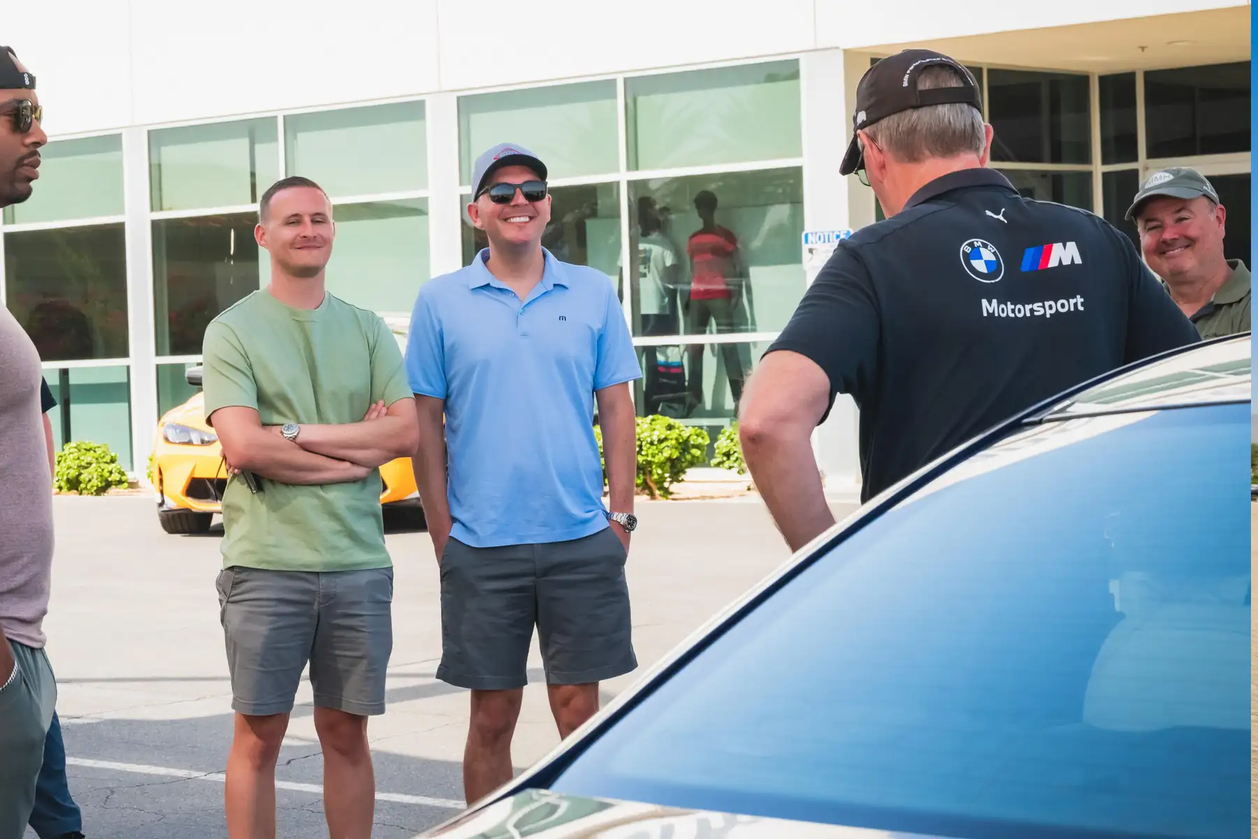 Instructor talking with a group of guests outside the Performance Center