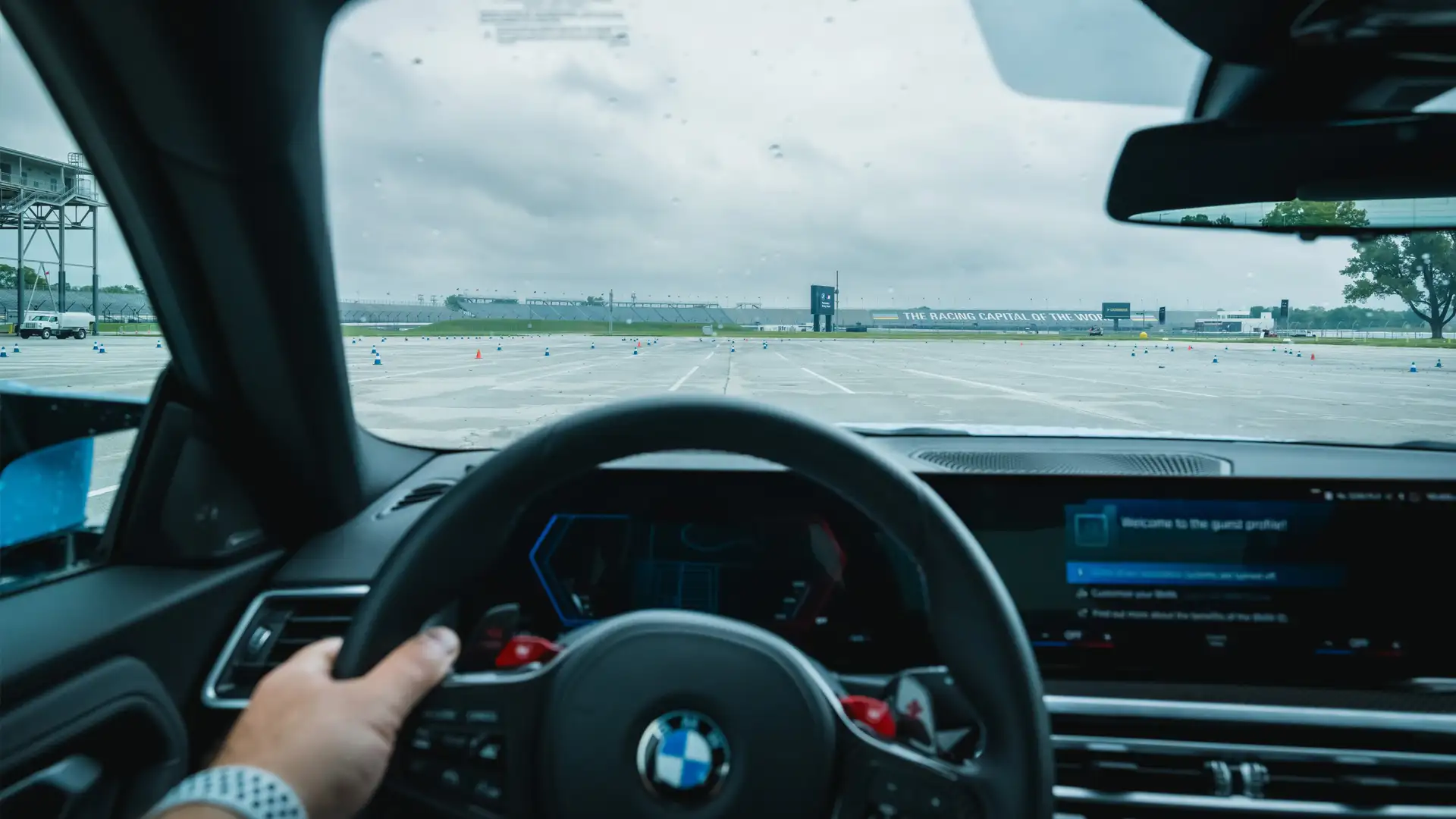 Driver's view over the steering wheel towards a coned course at Indianapolis Motor Speedway
