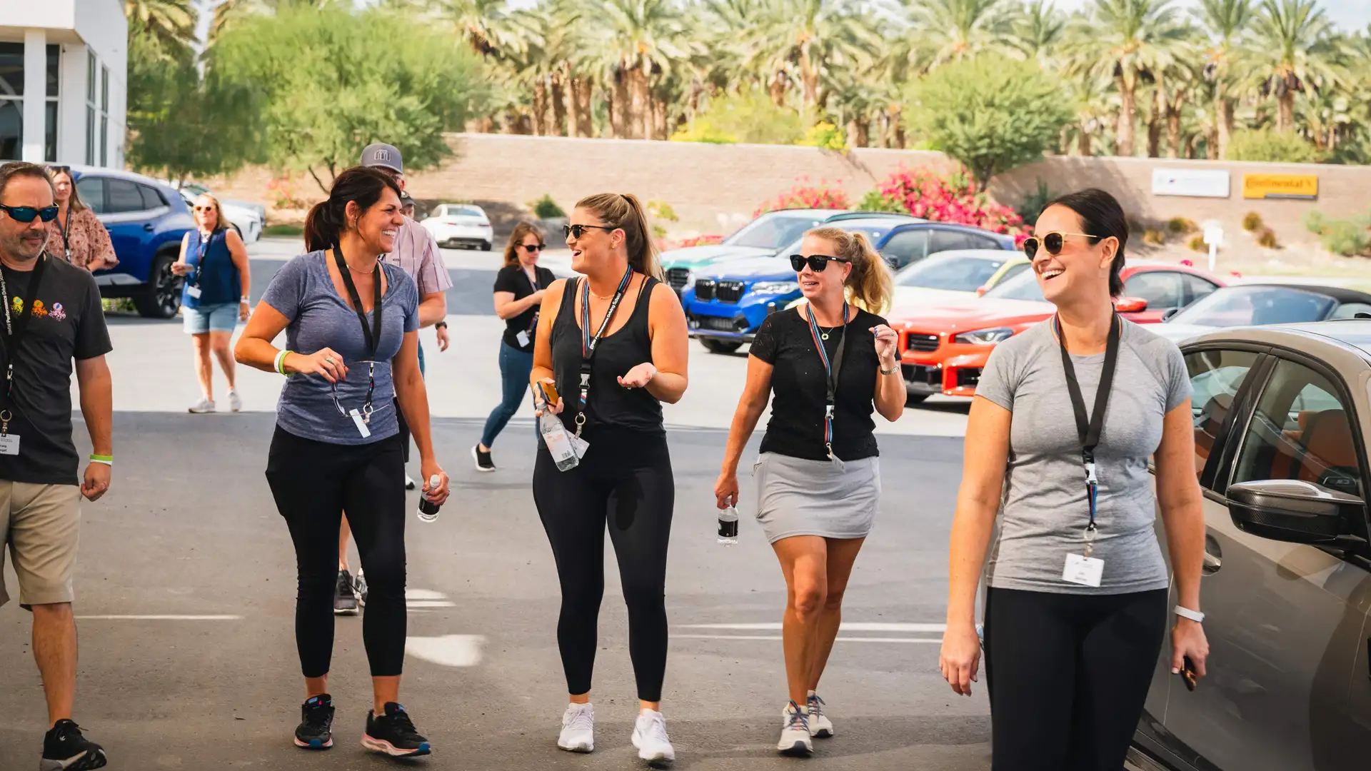 Group of guests walking and laughing through the paddock