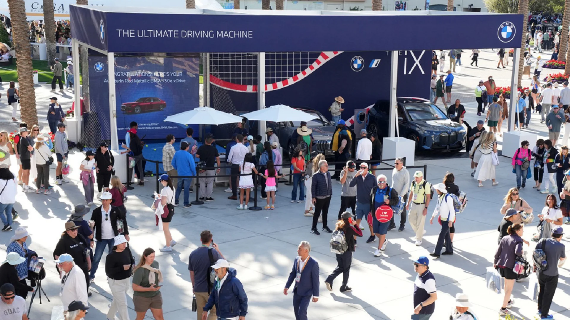 BMW iX display stand and crowds at the BNP Paribas Open