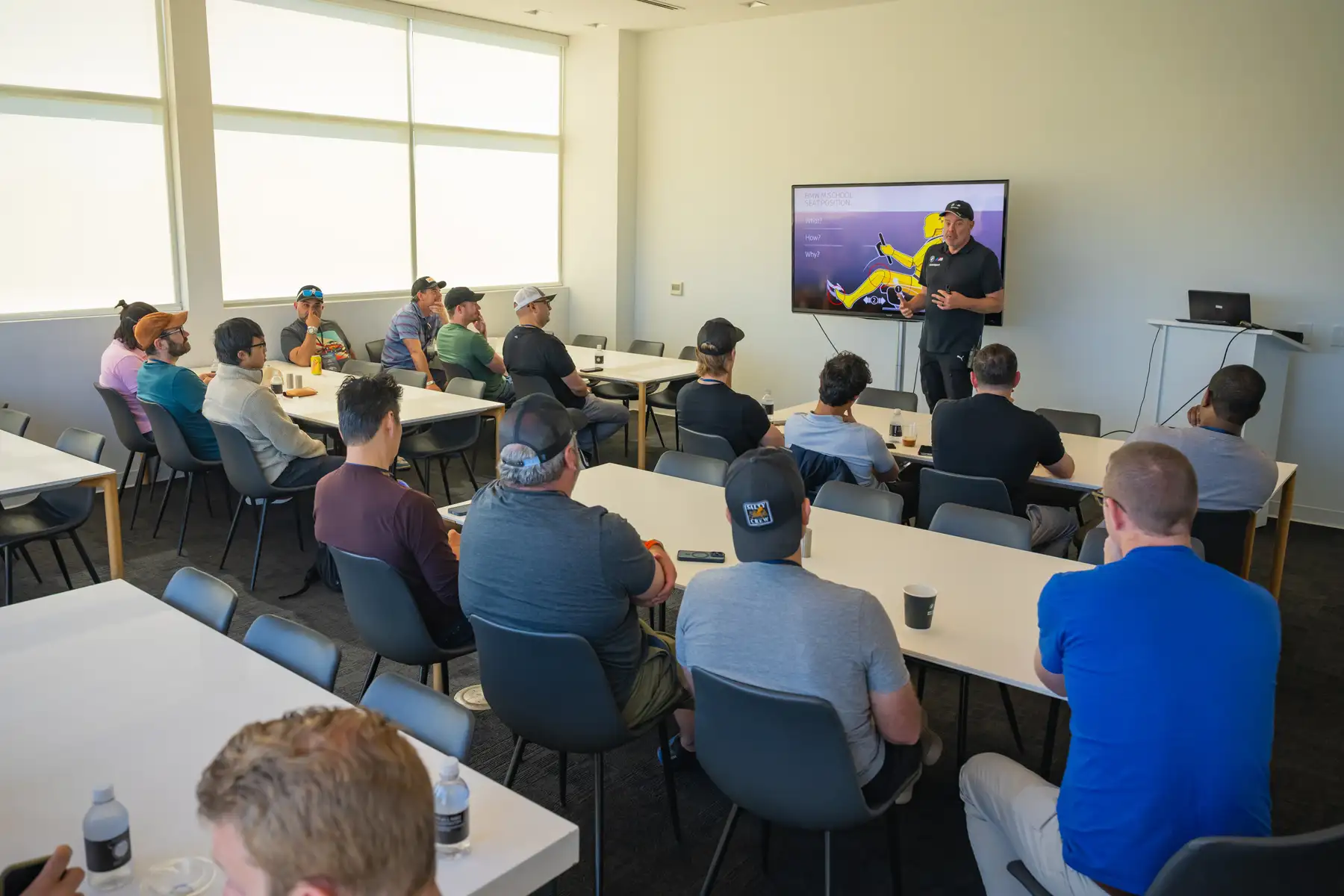 Instructor presenting to a full classroom of participants
