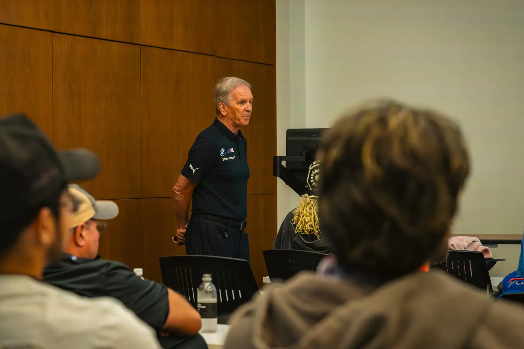 Instructor addressing students from the front of the classroom