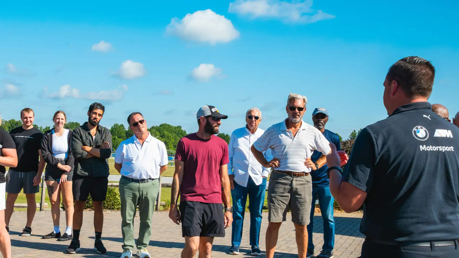 Instructor briefing a group of participants outdoors