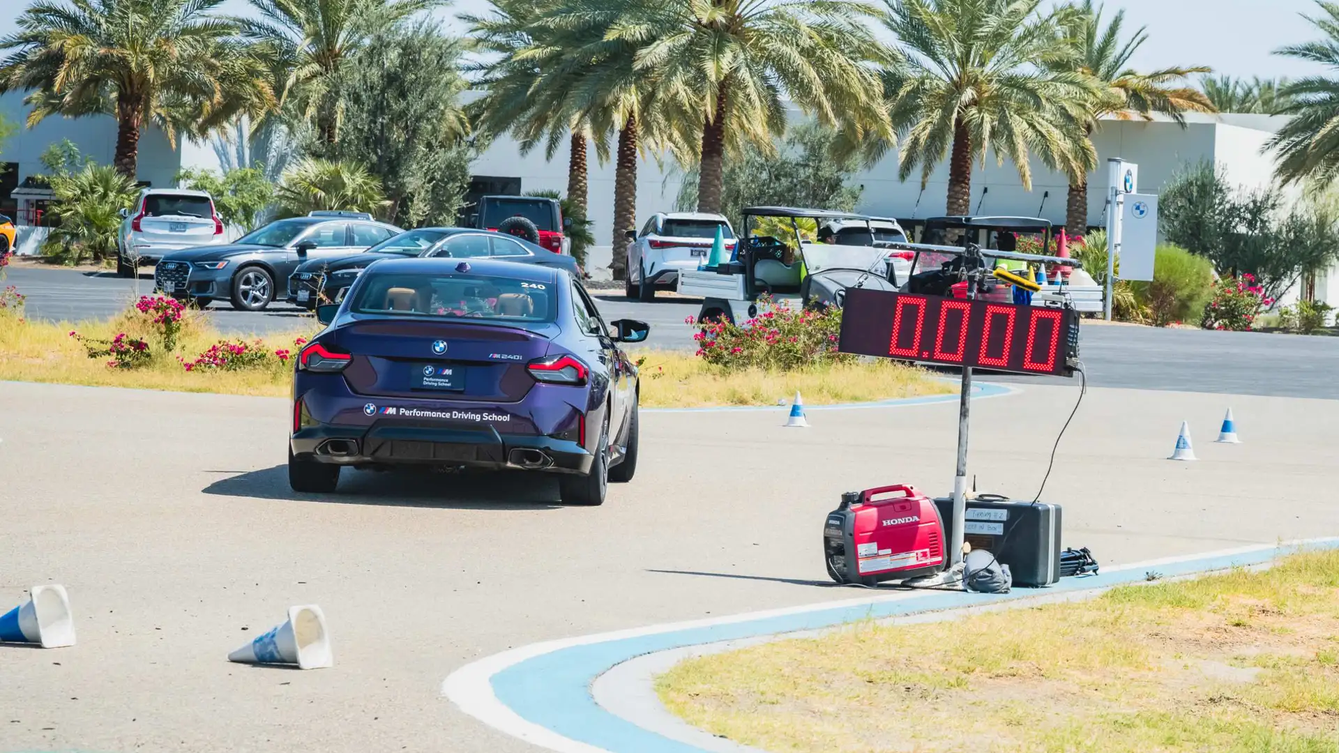BMW M240i approaching the timing board on the coned course