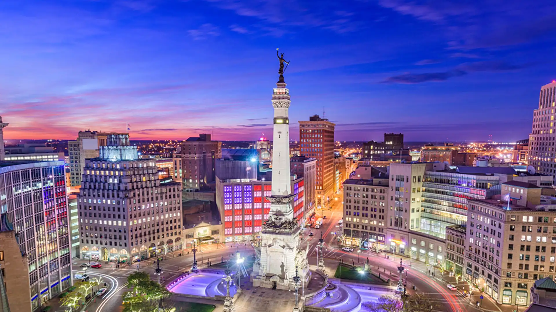 The Soldiers' and Sailors' Monument lit at dusk on Monument Circle in downtown Indianapolis