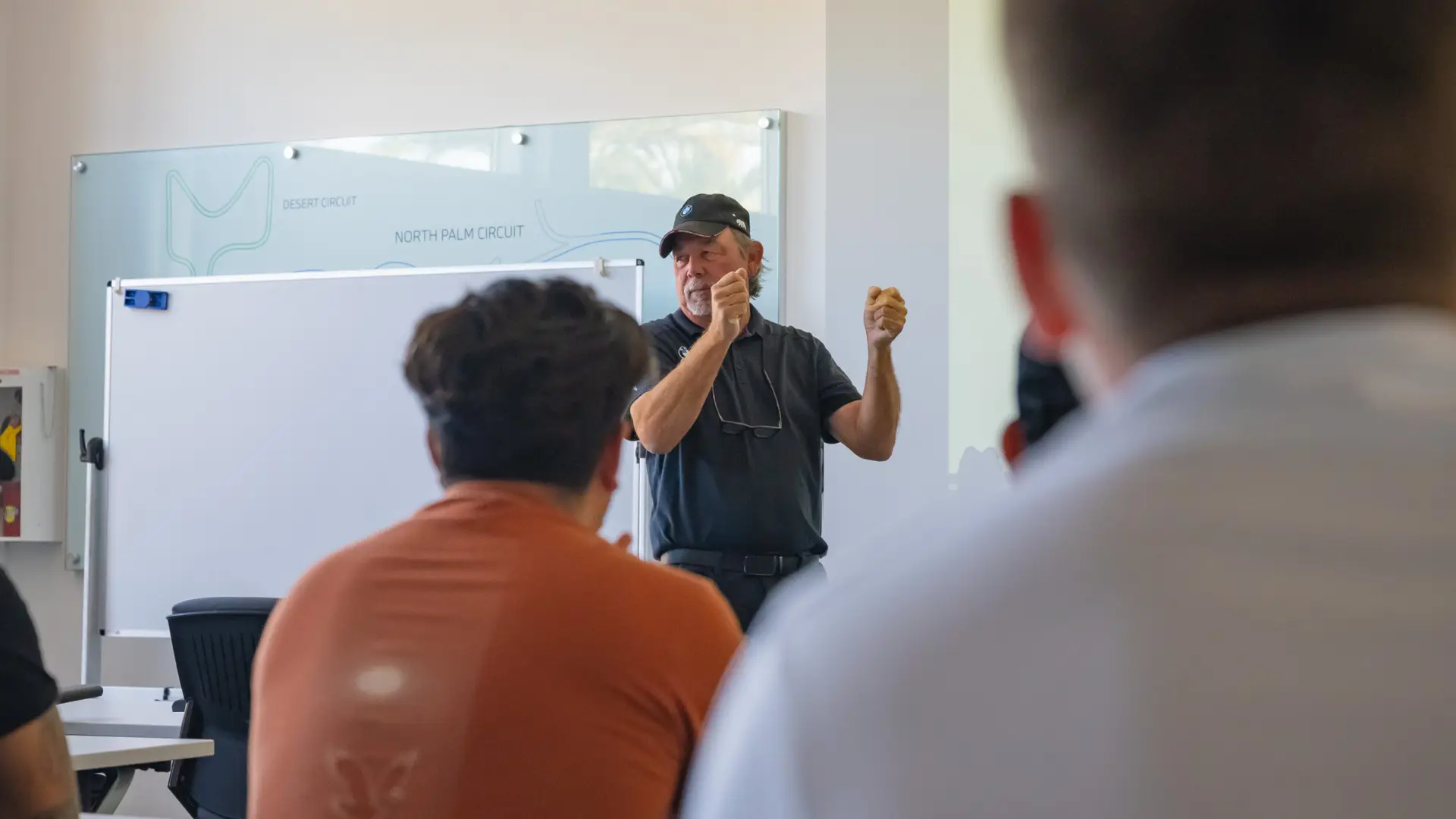 Instructor explaining the circuit layouts at the whiteboard