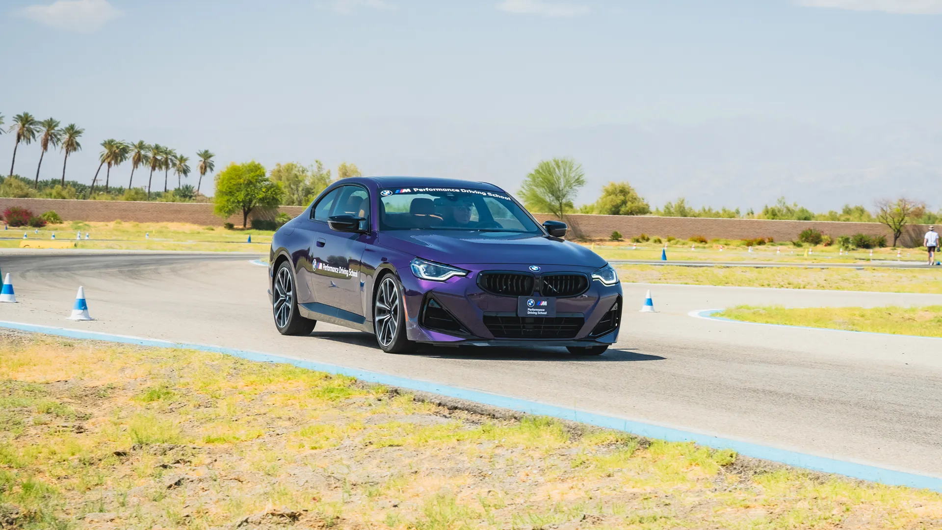 Purple BMW M2 on a coned course in the desert
