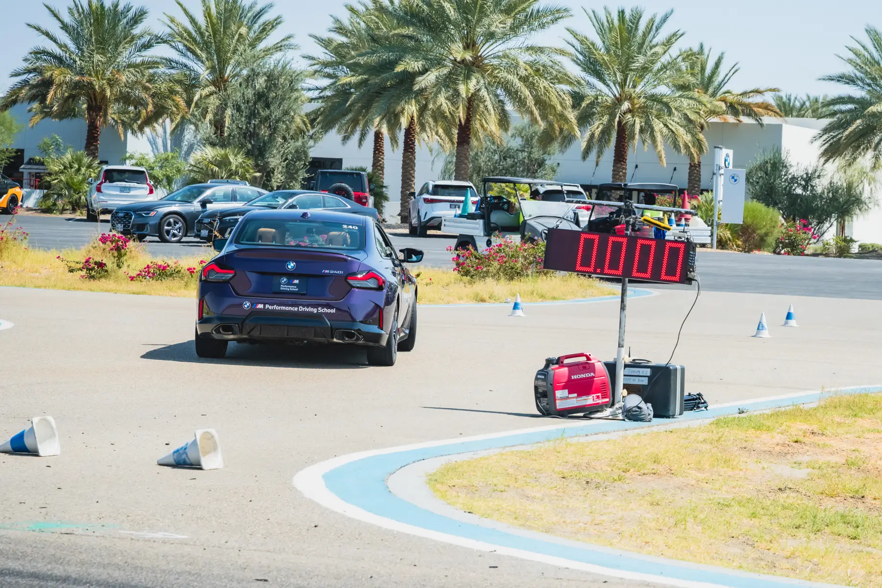BMW M240i approaching the timing board on the coned autocross course
